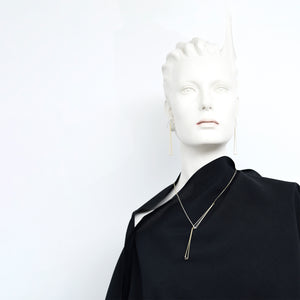 
                  
                    Glint Lariat Necklace
                  
                