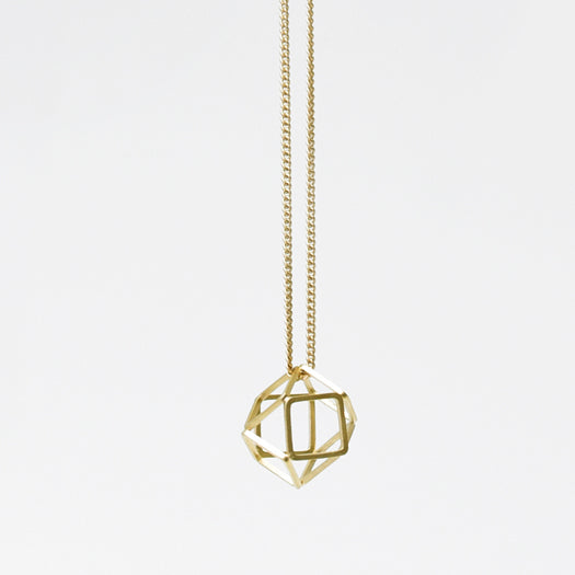 
                  
                    This minimal hexagon pendant hangs on a delicate curb chain and is a simple wardrobe staple
                  
                