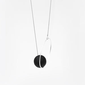 
                  
                    This playful necklace is available in many colourful options. Here we see a combination of a black orb with a silver ring and black snake chain
                  
                