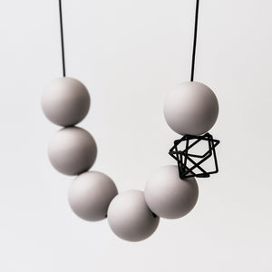 
                  
                    The bold orbs and deconstructed charm of this necklace makes for a statement necklace!
                  
                