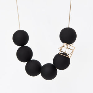 
                  
                    The bold orbs and deconstructed charm of this necklace makes for a perfect chunky  statement necklace!
                  
                