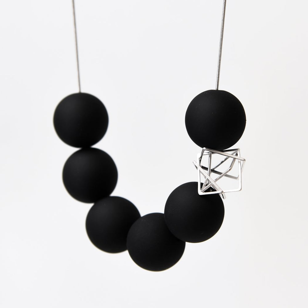 
                  
                    The bold orbs and deconstructed charm of this necklace makes for a statement necklace!
                  
                