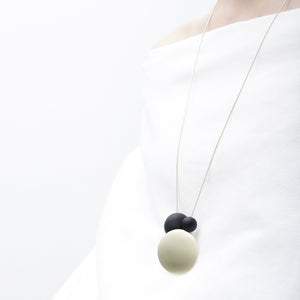 
                  
                    This pendant style long necklace is a sleek combination of materials and textures
                  
                
