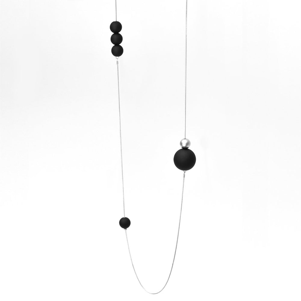 
                  
                    This balanced necklace is a lovely contrast to the sleek silver snake chain
                  
                