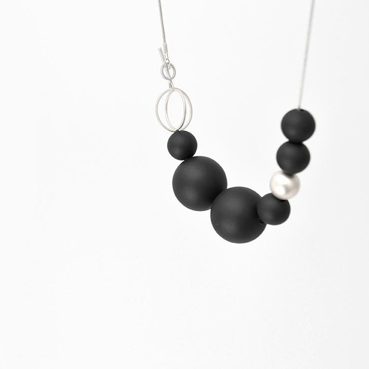 
                  
                    This geometric short necklace is a bold and classy statement piece held together with a simple toggle clasp.
                  
                