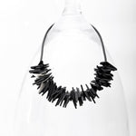 The angular resin beads of the short necklace bring lots of personality to any wardrobe! 