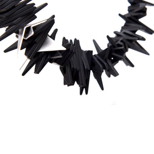 
                  
                    The angular resin beads of the short necklace bring lots of personality to any wardrobe! 
                  
                