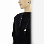 This bold necklace can either be worn as a single long strand or looped to create a layered effect