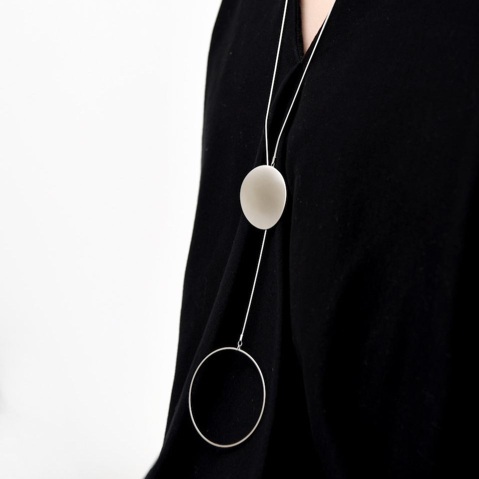 
                  
                    This circular lariat necklace can be worn two ways. Stylish and adaptable to any outfit!
                  
                