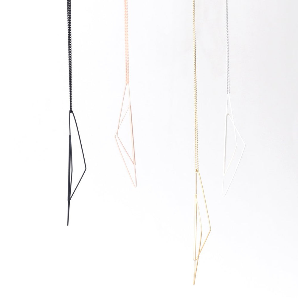 
                  
                    This simple geometric necklace was inspired by architecture and interior design
                  
                