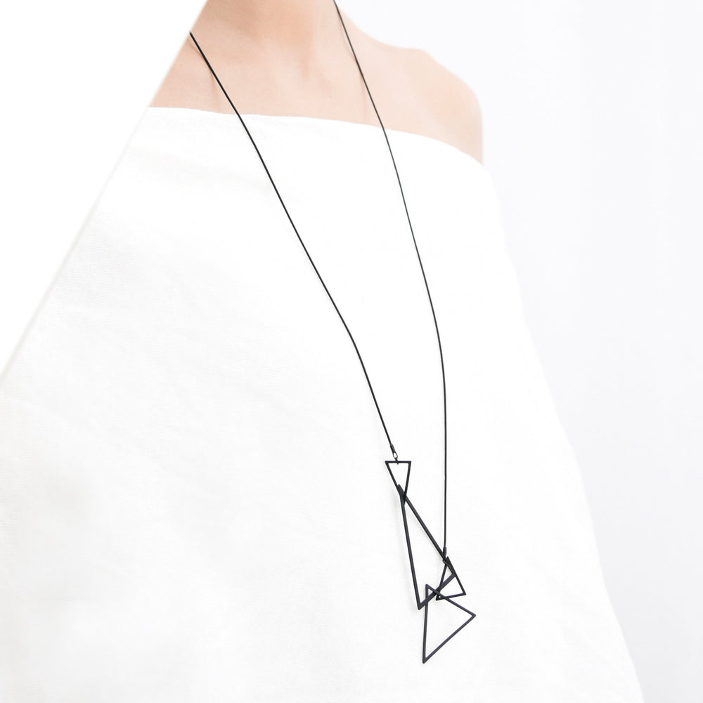 
                  
                    The minimal geometric triangles of this long necklace are lightweight and delicate. This is one of our most popular designs and makes a stylish addition to any outfit!
                  
                
