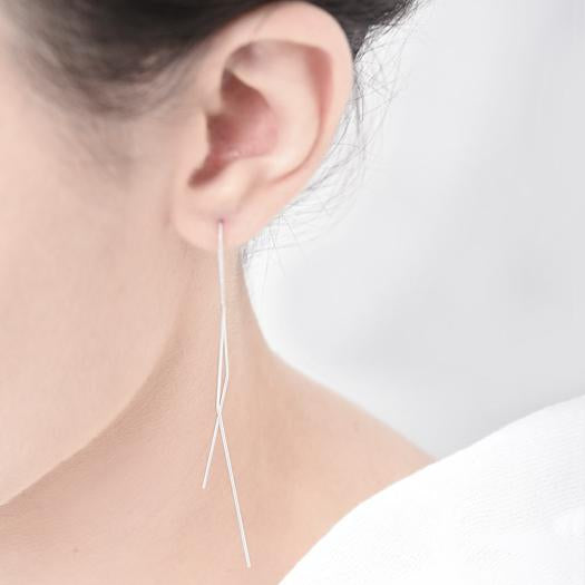 
                  
                    A delicate and minimal pair of ear drapes. Gently bent to frame the face in the most flattering way.
                  
                