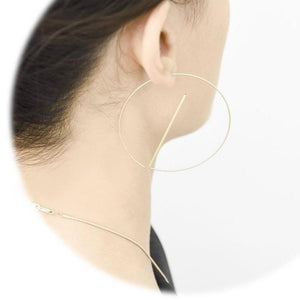 
                  
                    A lightweight and dynamic pair of earrings. These ear hoops are designed to float below the ear, a delicate statement pair the comes in gold, silver, and black as well as dual-tones.
                  
                